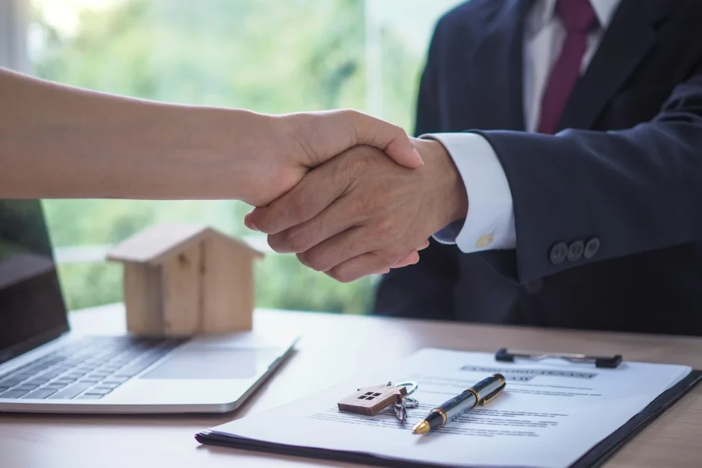 Close up of handshake for property settlement